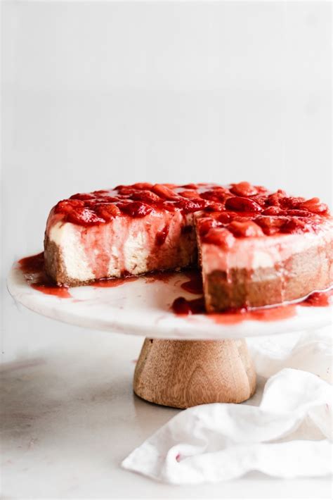 perfect-classic-cheesecake-with-homemade-strawberry-sauce image