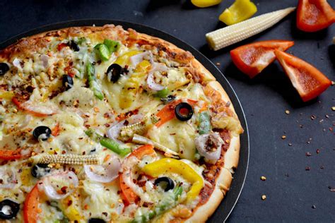 garlic-crust-vegetable-pizza-recipe-archanas-kitchen image
