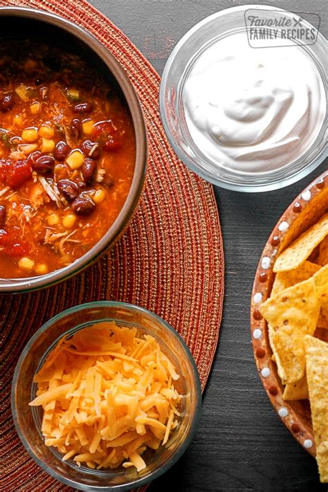 southwest-taco-soup-topped-with-cheese-sour image