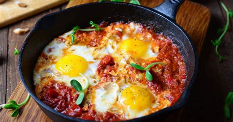baked-eggs-with-tomatoes-and-parmesan-slender-kitchen image