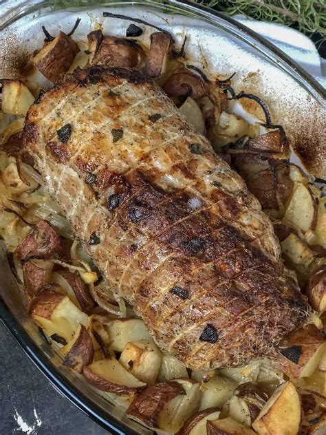 roast-pork-loin-with-apples-potatoes-and-onions image