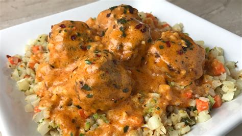 coconut-curry-chicken-meatballs-over-cauliflower-rice image