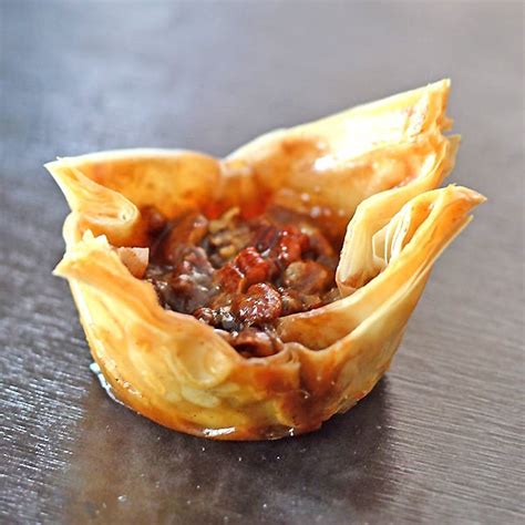 phyllo-pastry-cups-filled-with-traditional-pecan-pie-take image