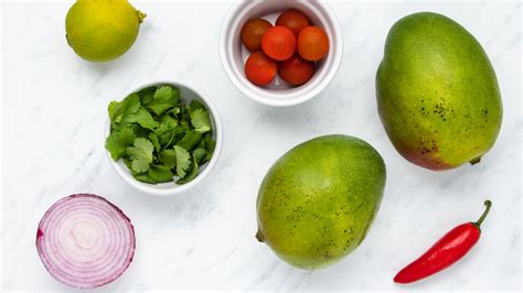 easy-mango-salsa-recipe-tasting-table image
