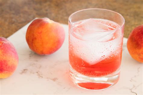 sparkling-peach-sunrise-mocktail-recipe-non-alcoholic-the image