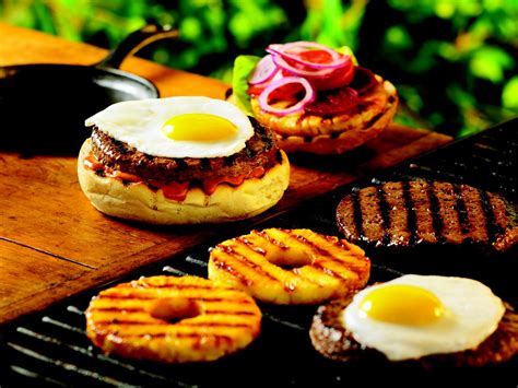 aussie-burger-with-fried-egg-beets-and-pineapple image