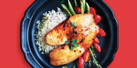 baked-tilapia-with-roasted-asparagus-tomatoes image