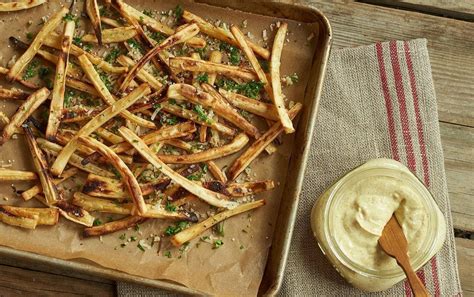 baked-parsnip-fries-with-curry-lime-yogurt-dip image