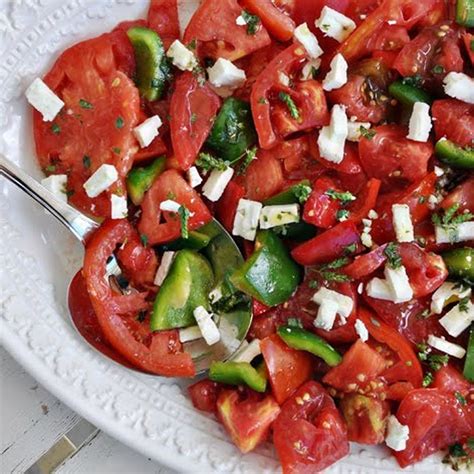 heirloom-tomato-salad-with-feta-oregano-flowers image