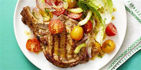 pork-chops-with-bloody-mary-tomato-salad image