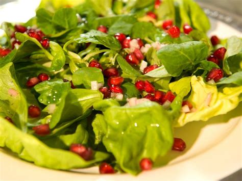 butter-lettuce-mache-and-pomegranate-seeds image