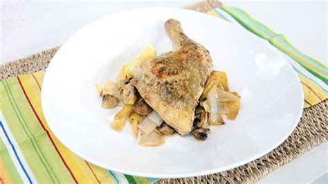 baked-chicken-with-tarragon-butter-over-charred-leeks image
