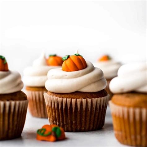 pumpkin-cupcakes-with-cream-cheese-frosting image