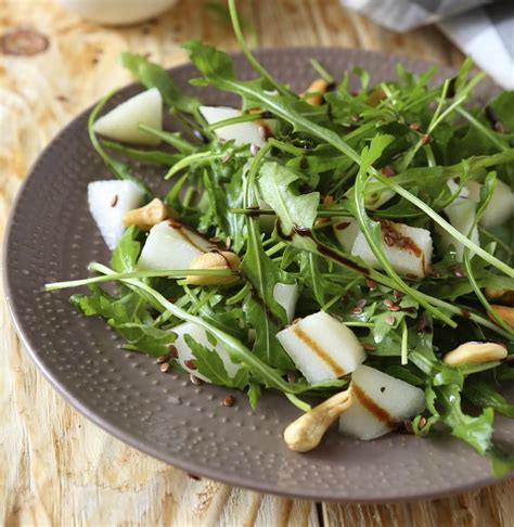 poached-pear-salad-with-white-wine-vinaigrette image