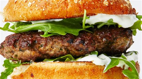lamb-burgers-with-yogurt-sauce-and-arugula image