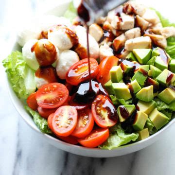 caprese-avocado-salad-damn-delicious image