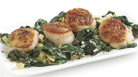 seared-scallops-with-creamy-spinach-and-leeks image