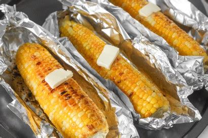 oven-roasted-corn-on-the-cob-with-garlic-butter image