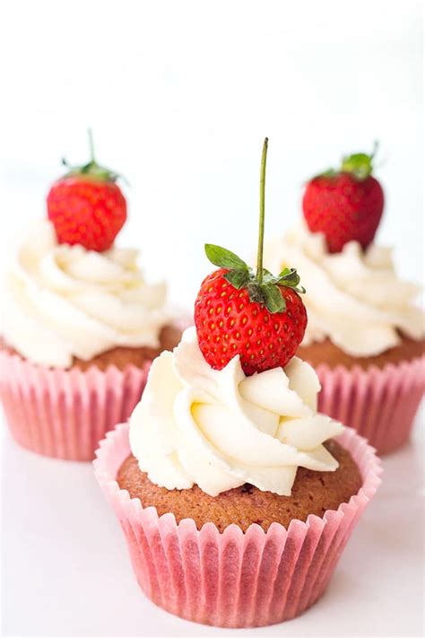 fresh-strawberry-cupcakes-with-whipped-cream-frosting image