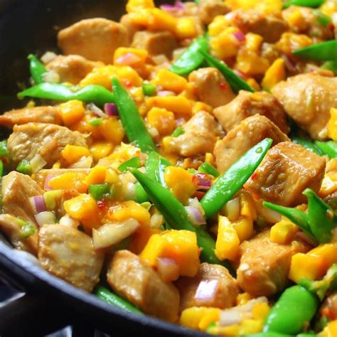 mango-chicken-stir-fry-with-snap-peas-taste-and-see image