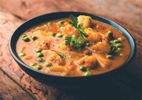 potato-curry-with-peas-carrots-recipe-the-spice image