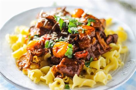 braised-beef-with-caramelized-onions-and-mushrooms image