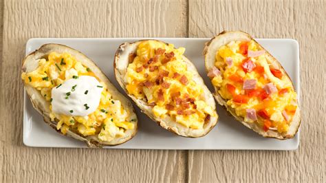 breakfast-baked-potato-boats-stuffed-with-cheesy-eggs image