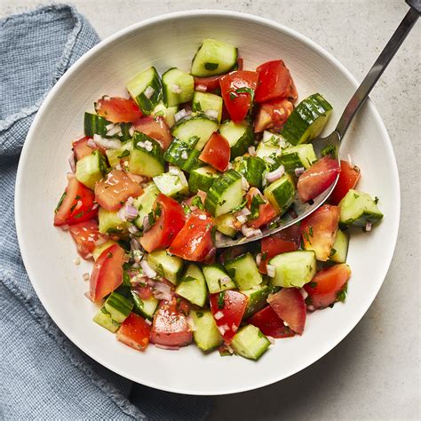 chopped-cucumber-tomato-salad-with-lemon-eatingwell image