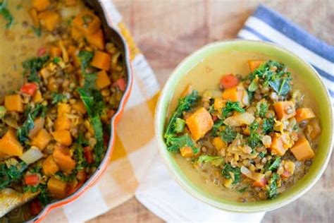 butternut-squash-lentil-coconut-curry-soup-greens image