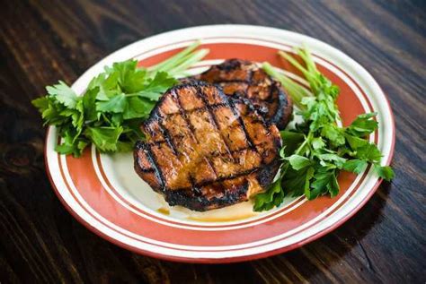 coffee-and-molasses-marinated-pork-chops-grilling image
