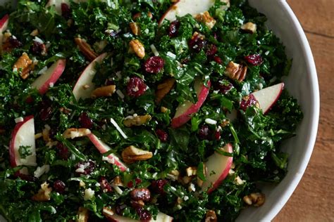 kale-salad-with-cranberries-apples-and-pecans image