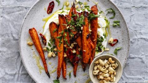 chilli-roasted-carrots-with-cashews-recipe-good-food image
