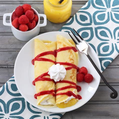 lemon-and-raspberry-crepes-cooking-on-the-front-burner image