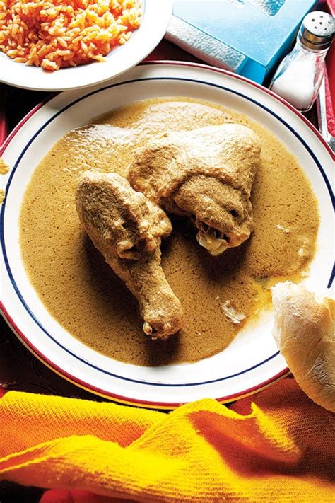 chicken-with-pumpkin-seedtomatillo-sauce-pollo-en image