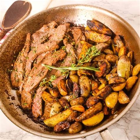 skillet-steak-and-potatoes-with-garlic-and-thyme-it-is-a image