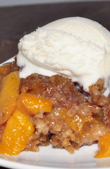 crock-pot-peach-cobbler-wishes-and-dishes image