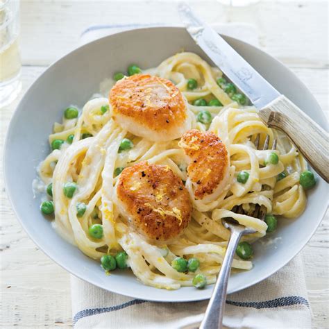 seared-scallops-with-creamy-fettuccine-and-peas image