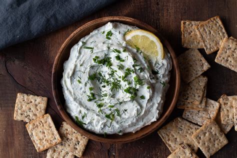 lemon-herb-goat-cheese-spread-with-two-spoons image