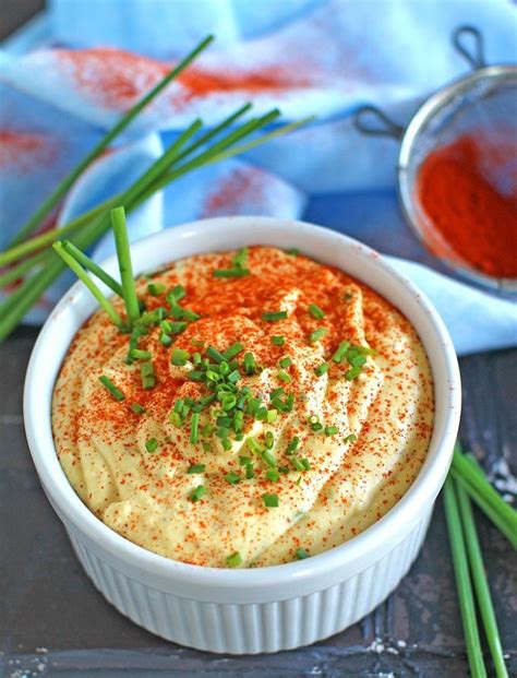 deviled-eggs-dip-with-chives-and-paprika image