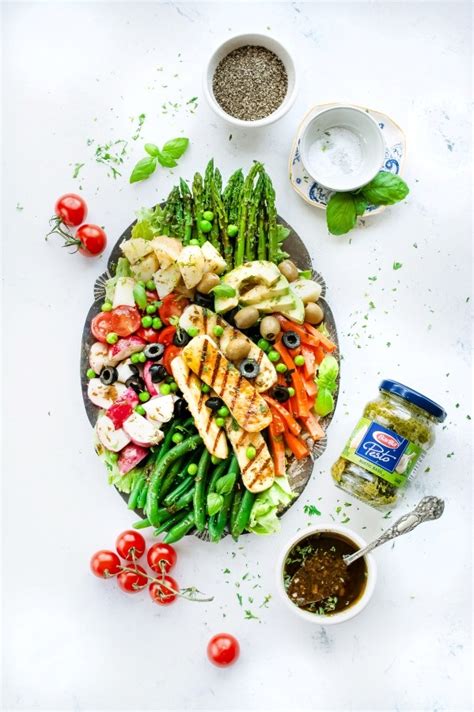 nioise-salad-with-rustic-basil-pesto-based-vinaigrette image