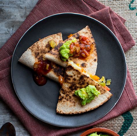 cheese-quesadillas-with-peppers-onions-eatingwell image