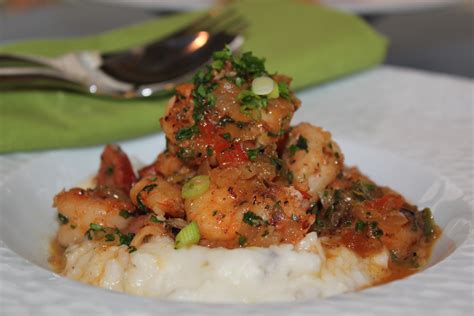 spicy-shrimp-and-andouille-over-charleston image
