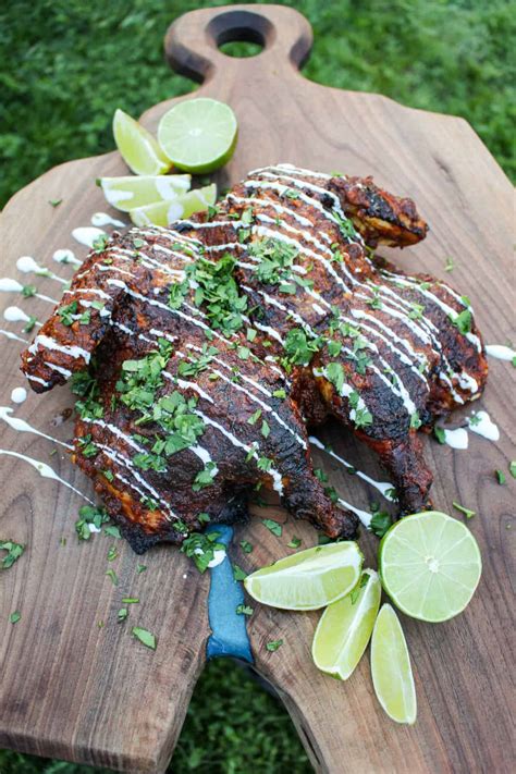 achiote-lime-brick-pressed-chicken-over-the-fire-cooking image