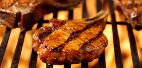 grilled-pork-chops-with-mushrooms-sauted-in-bourbon image