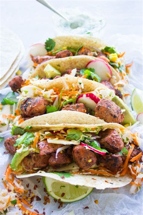 tandoori-chicken-tacos-with-cilantro-corn-slaw-two image