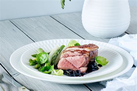 seared-duck-with-blueberry-sauce-canadian-living image
