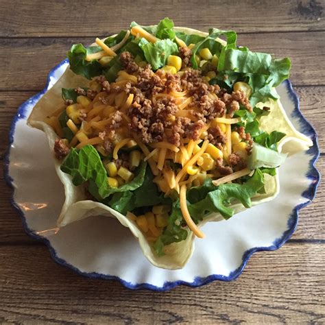 easy-taco-salad-recipe-in-crunchy-taco-shell-bowls image