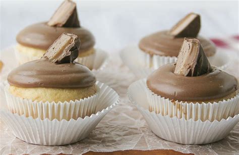 vanilla-cupcakes-with-milky-way-frosting-the-daily-meal image
