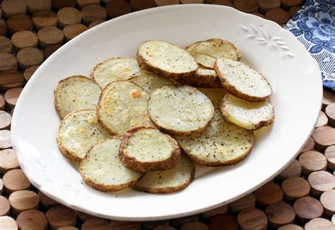 roasted-baked-potato-slices-recipe-the-spruce-eats image