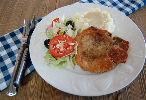 pan-fried-pork-chops-with-country-gravy-cooking image